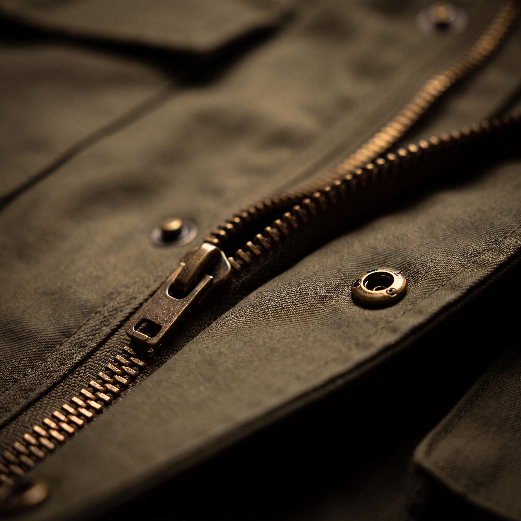 MACRO 02 — brass zip teeth + snap · shallow depth